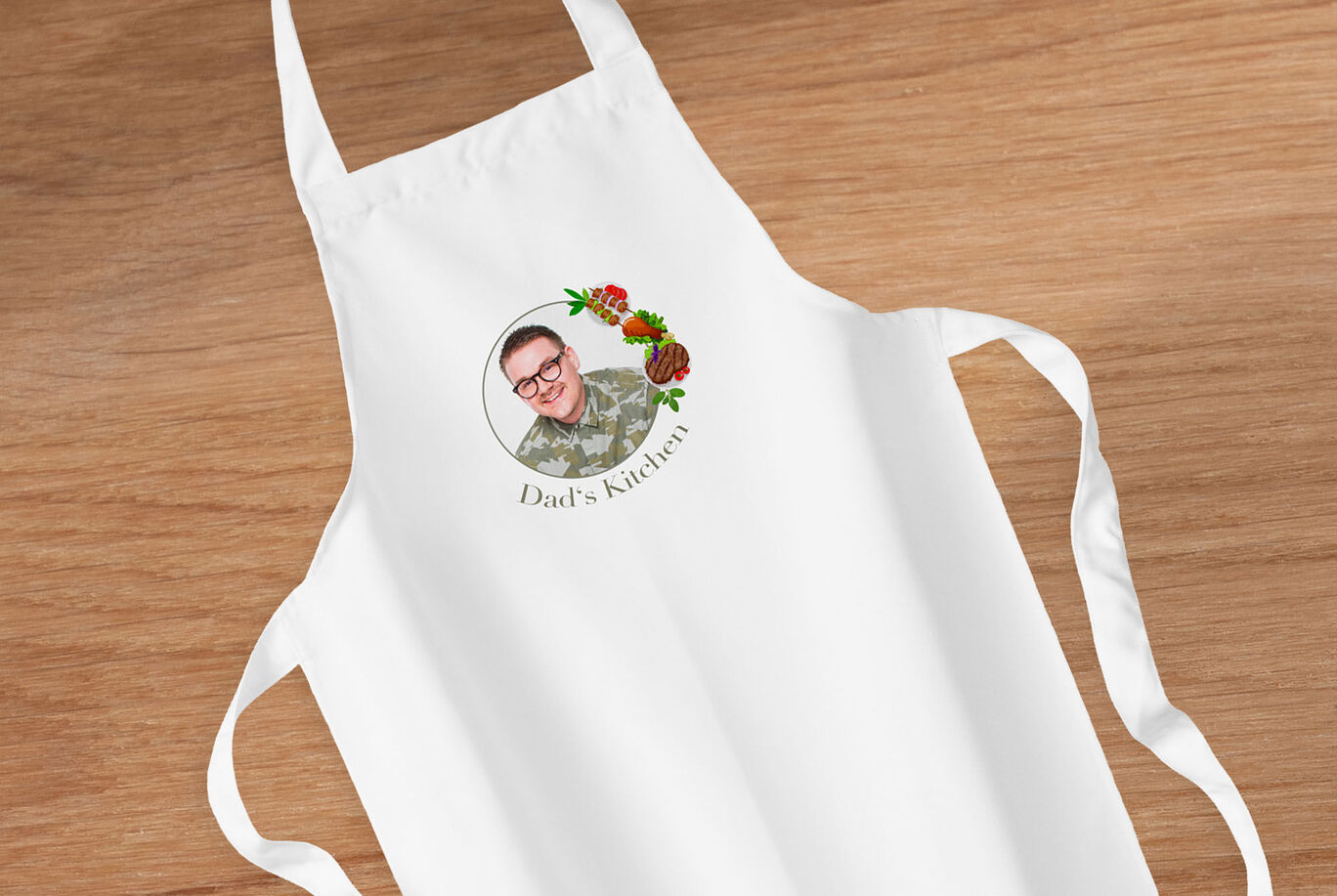 White kitchen apron with a personalized design.