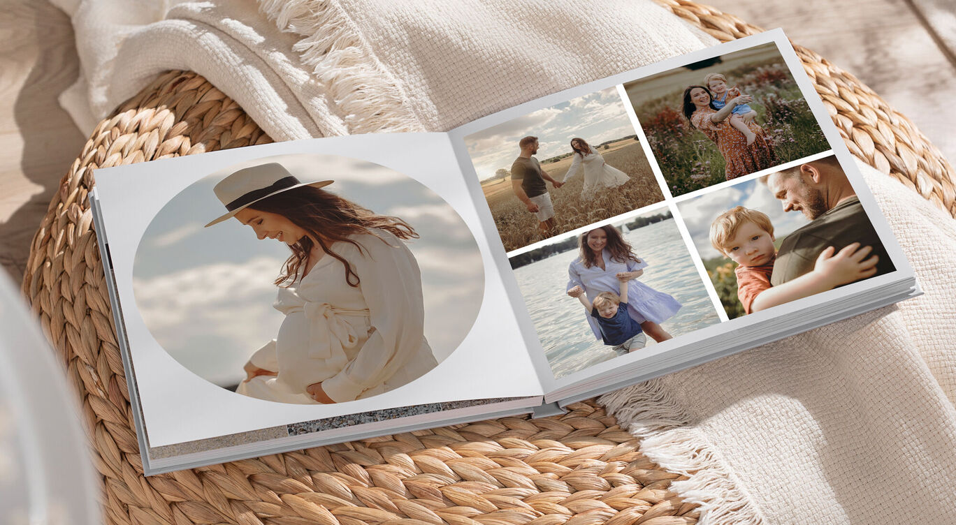 A pregnant woman holds her baby in a photo book. Beautiful moments and memories are captured.