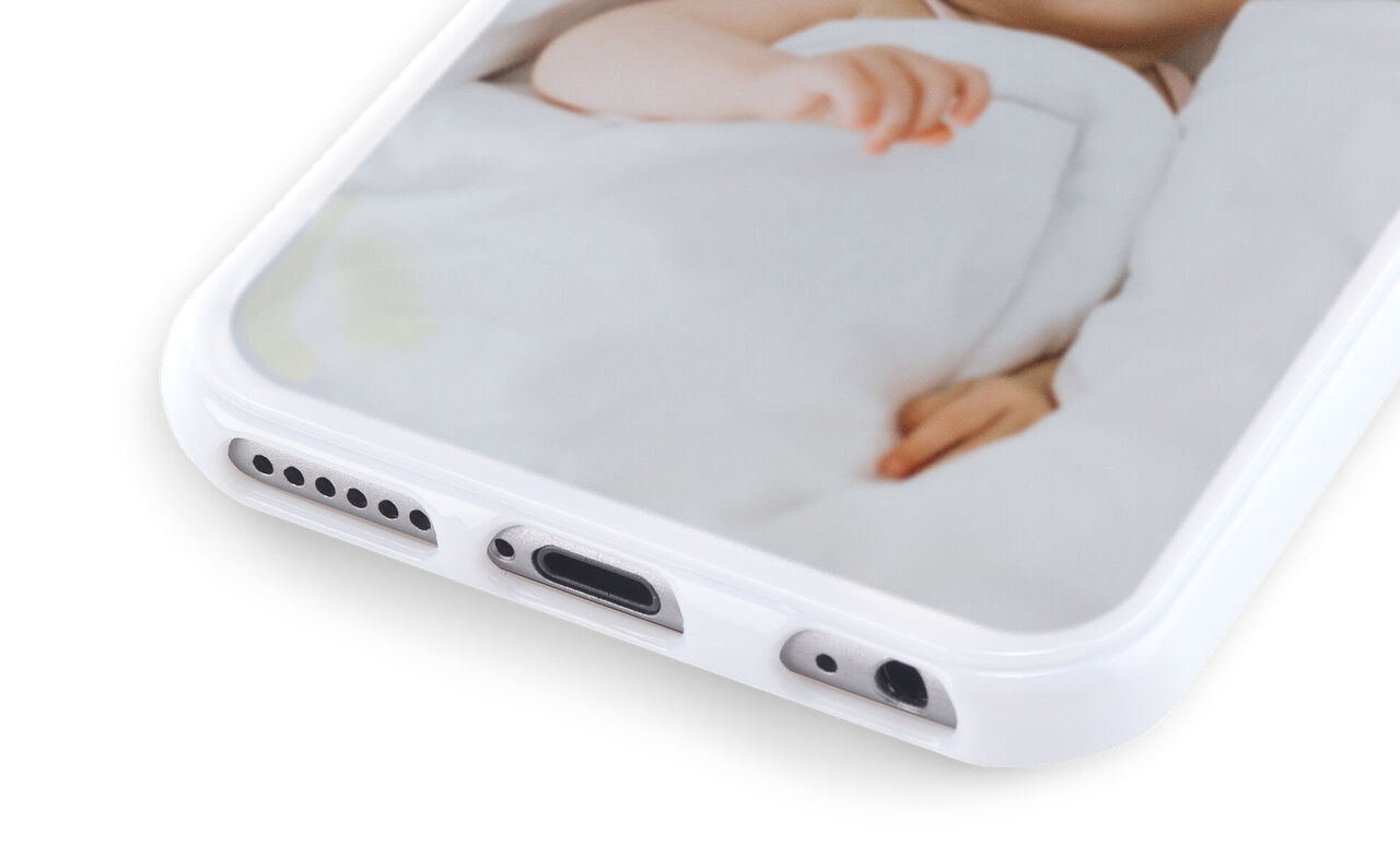 Smartphone with personalized photo design on the back, showing loving details.