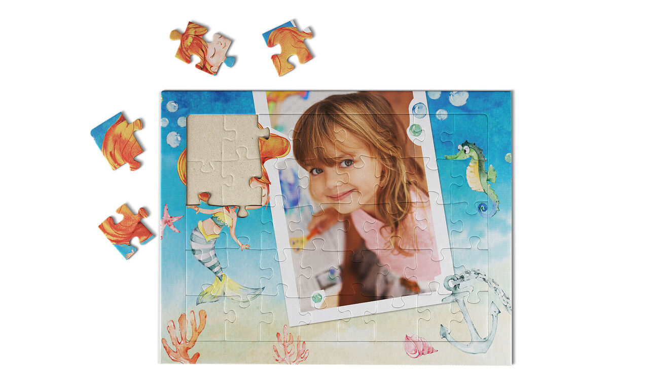 A colorful puzzle with sea motifs and a photo fitted into the puzzle area.