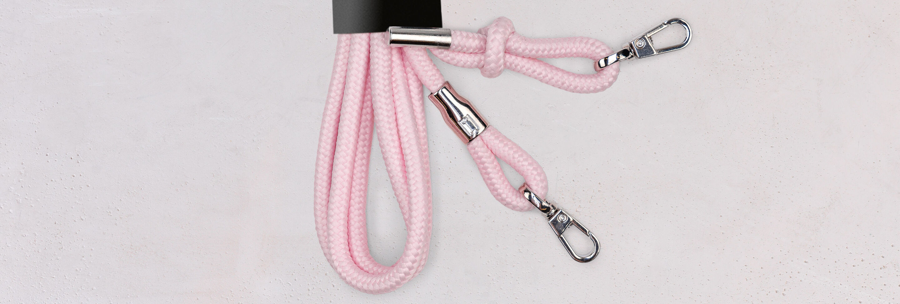 Two pink keychains with silver carabiners