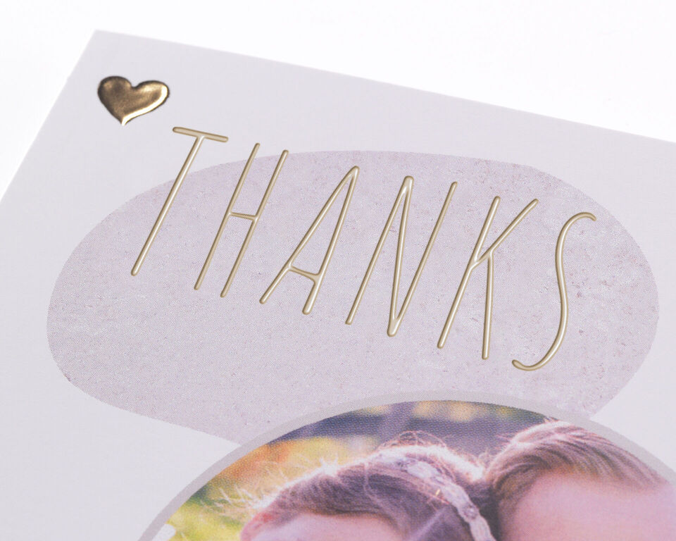 Thank you card with heart motif and the word 'THANKS' on a light background