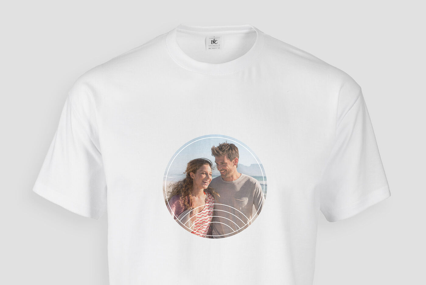 A couple in a white T-shirt with a round picture frame radiating joy.