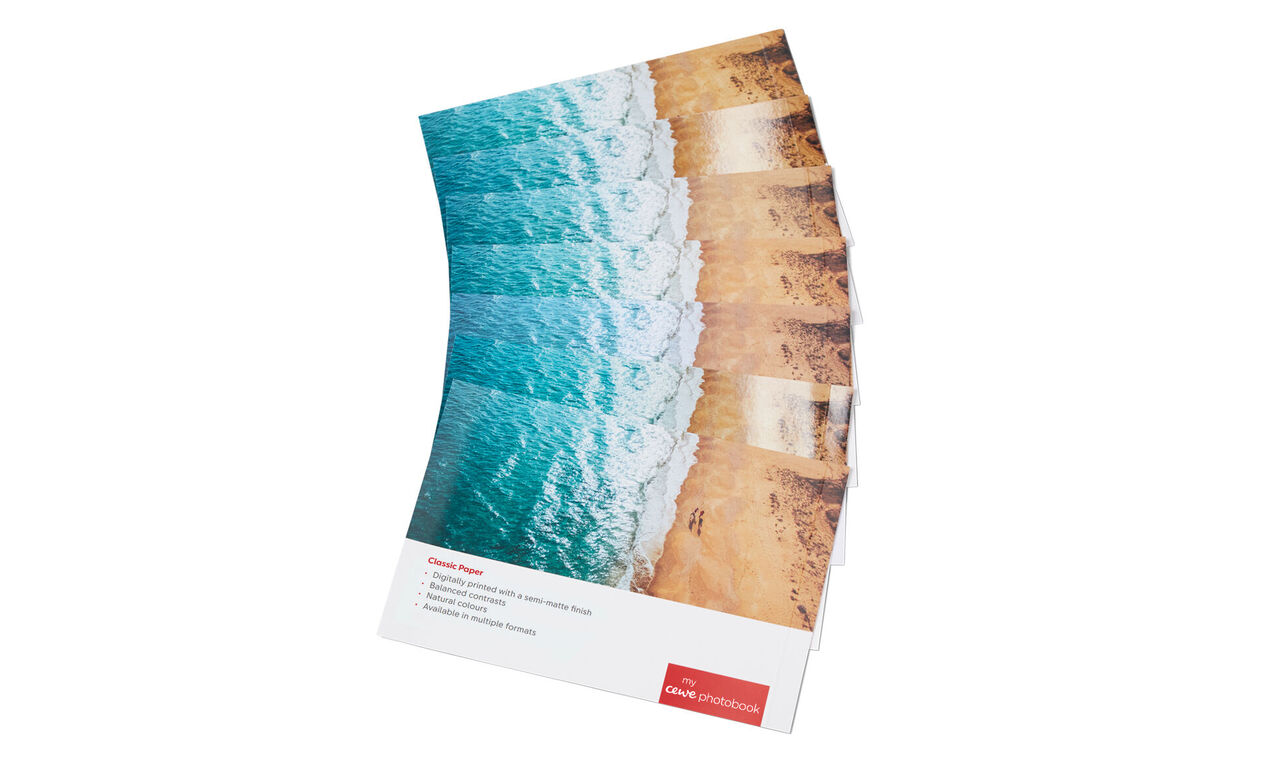 CEWE photo book with vacation memories and lovely pages at the beach.