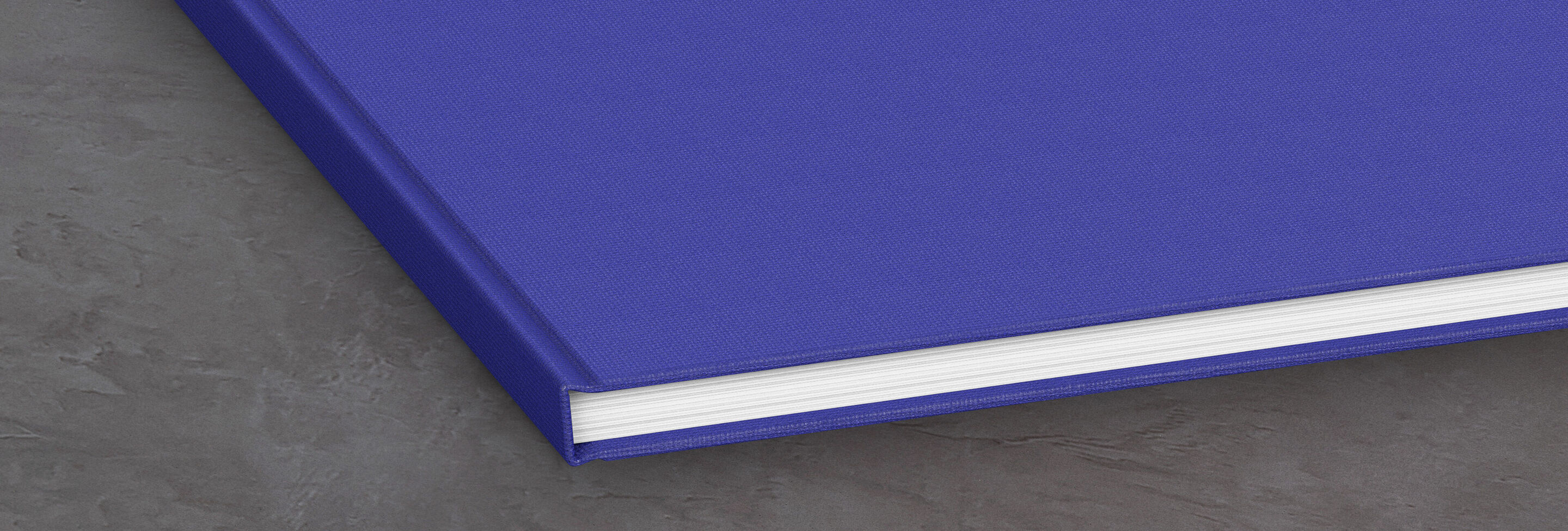 Thick blue book cover made of high-quality material, partially opened