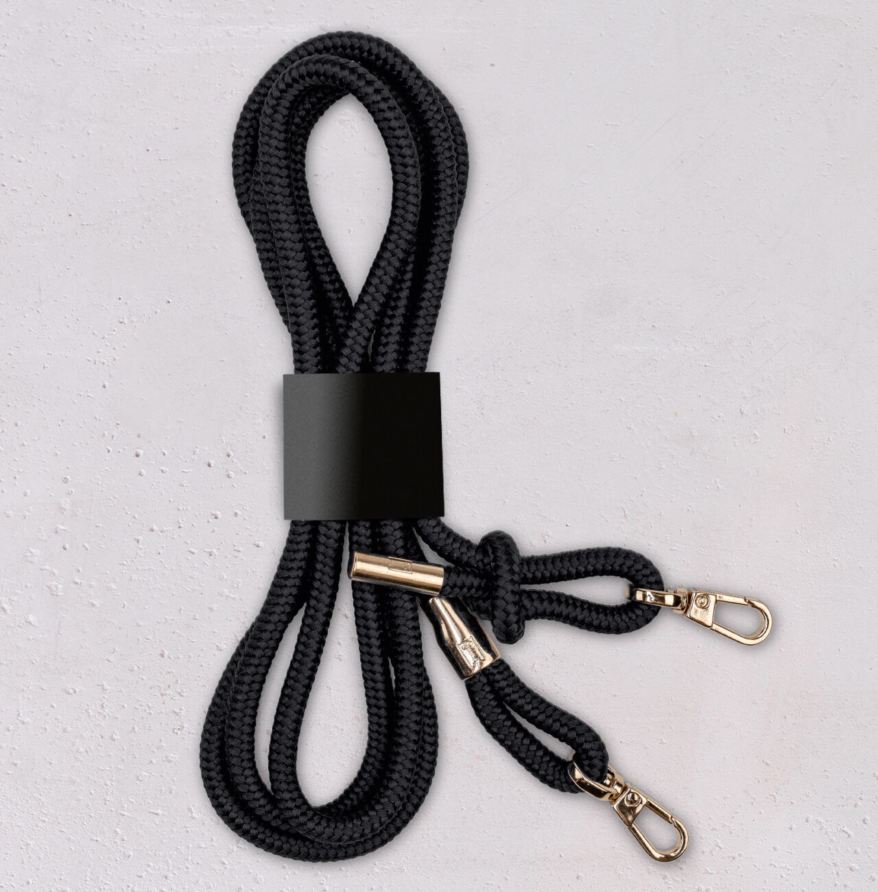 Black braided rope with two carabiners.
