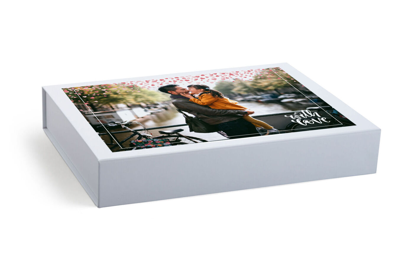 A loving gift with a photo of a couple embracing in a city. The packaging has hearts and floral patterns.