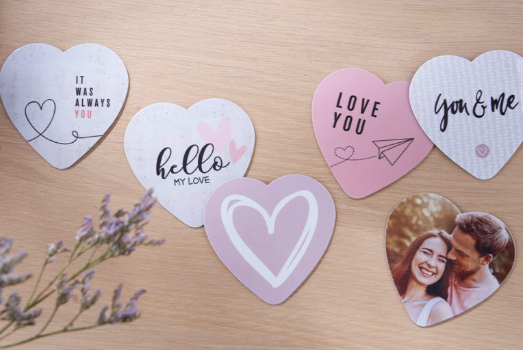 Colorful heart-shaped greeting cards with loving messages and a photo.