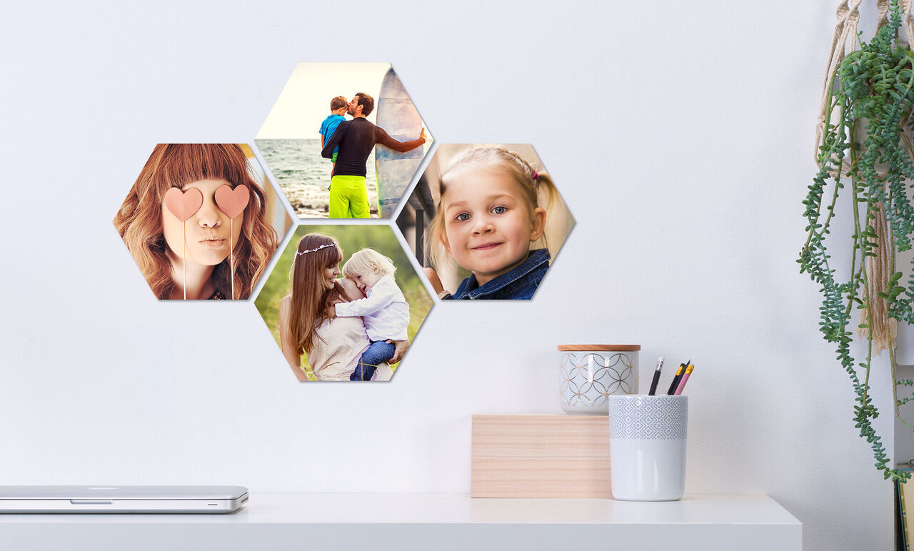 Hexagonal photo collage with family pictures on a wall.