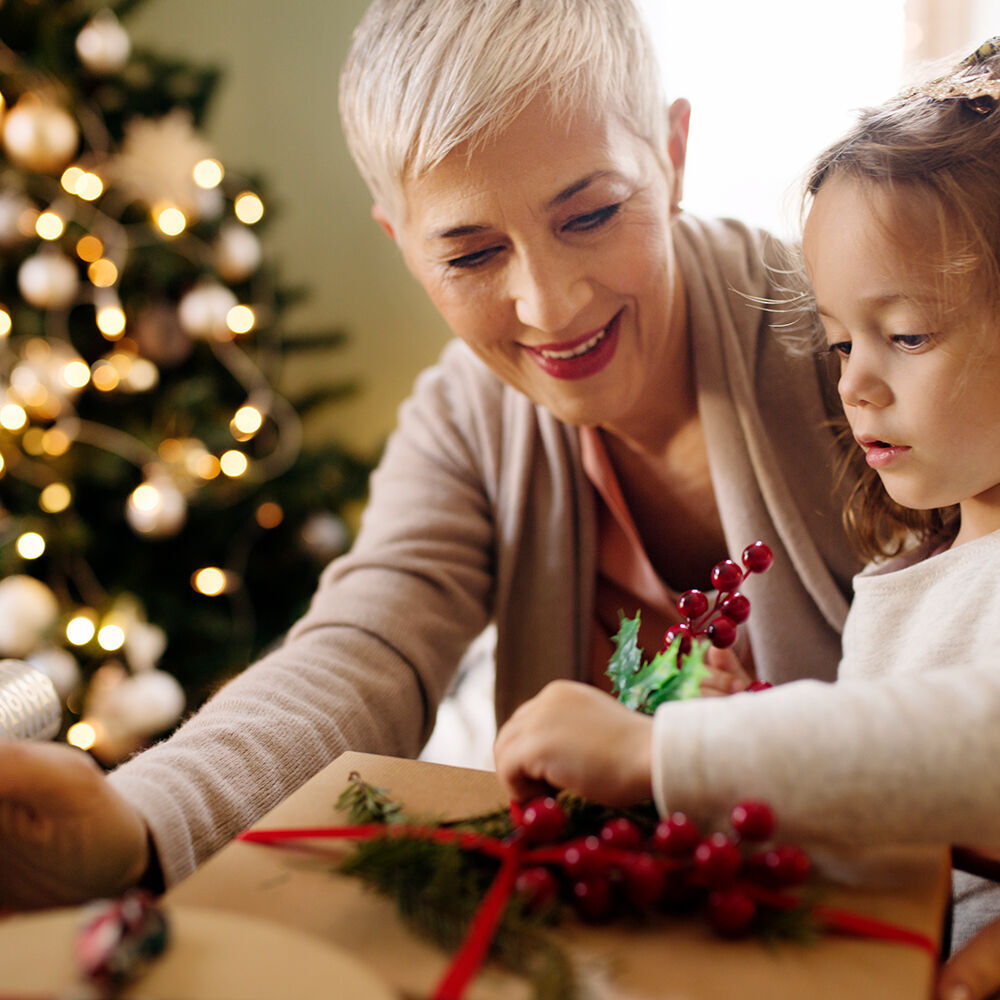 A warm Christmas scene with gifts and fir branches