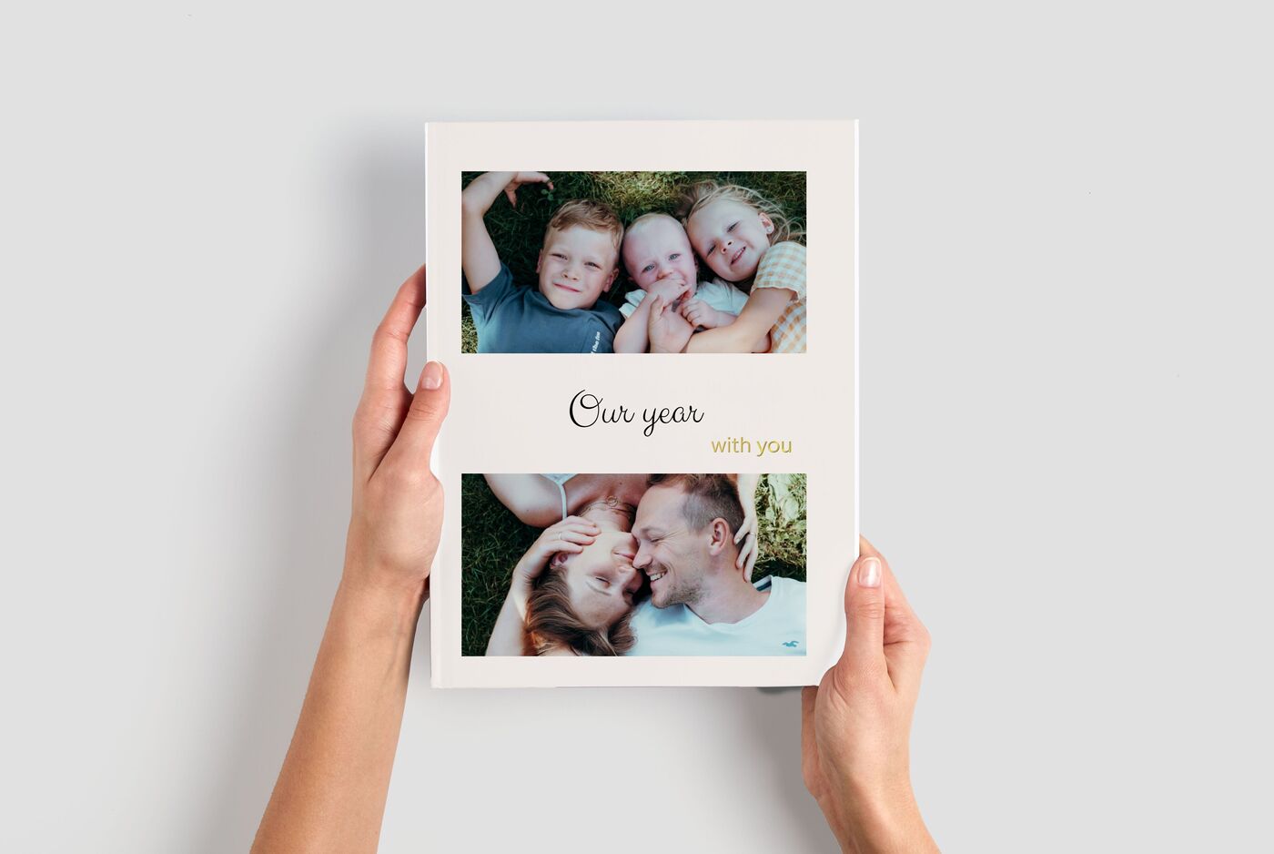 Two photos in a photo book show happy moments of a family.