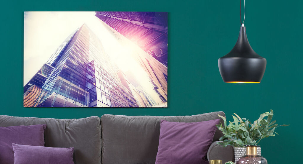 Modern architecture of a skyscraper against a green wall background