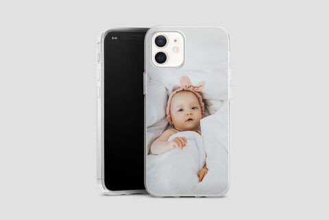 A loving depiction of a phone case design with a sleeping baby figure wrapped in a blanket