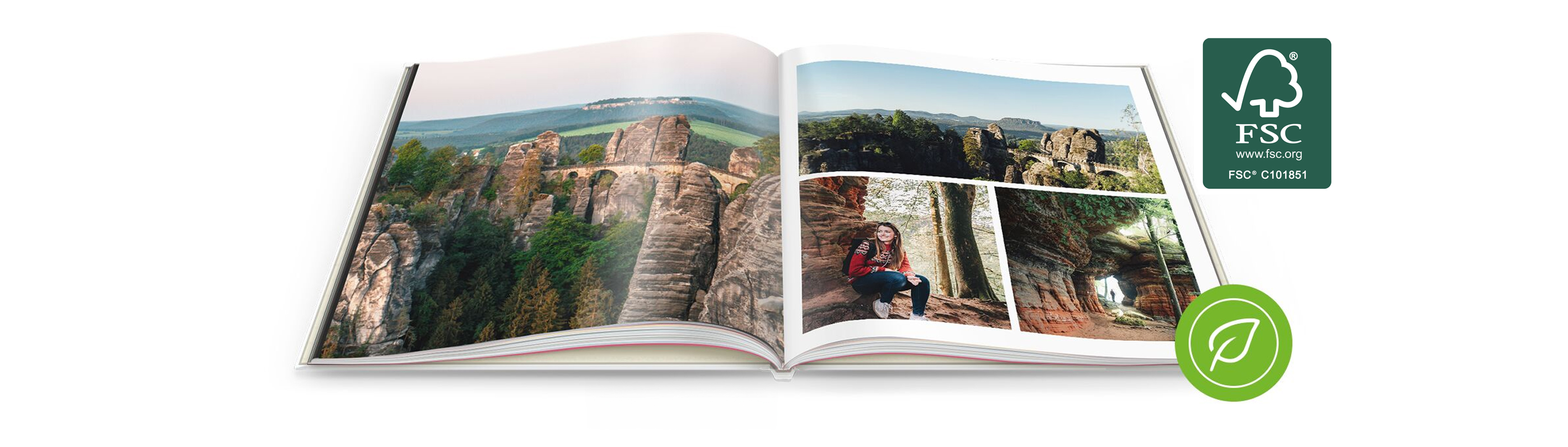 Open CEWE PHOTO BOOK with landscape and adventure photos on a round wooden surface.