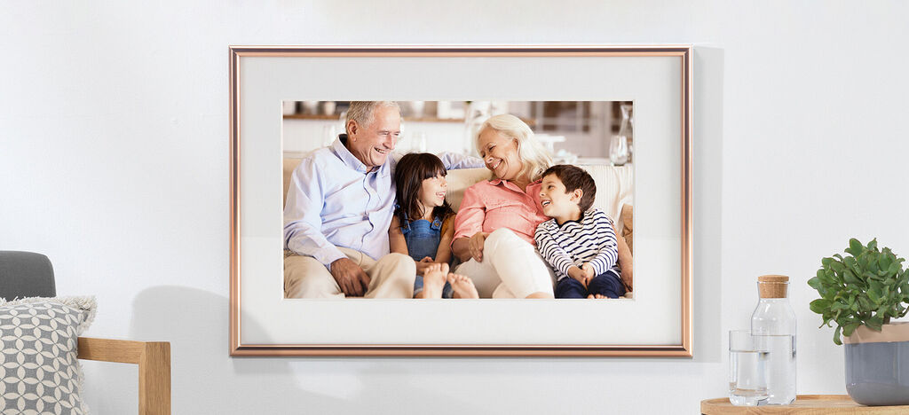 A loving family on a sofa enjoying time together.