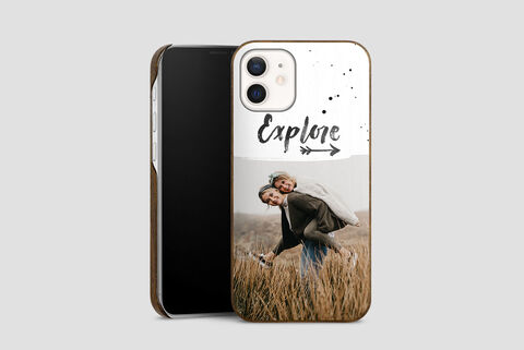 People enjoy a moment in nature with a smartphone case design. The design shows the word 'Explore' with an arrow and paint splashes.