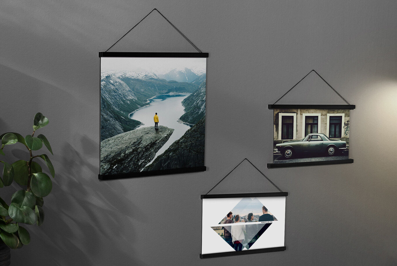 Wall pictures hang on a wall, featuring nature, city, and group motifs.