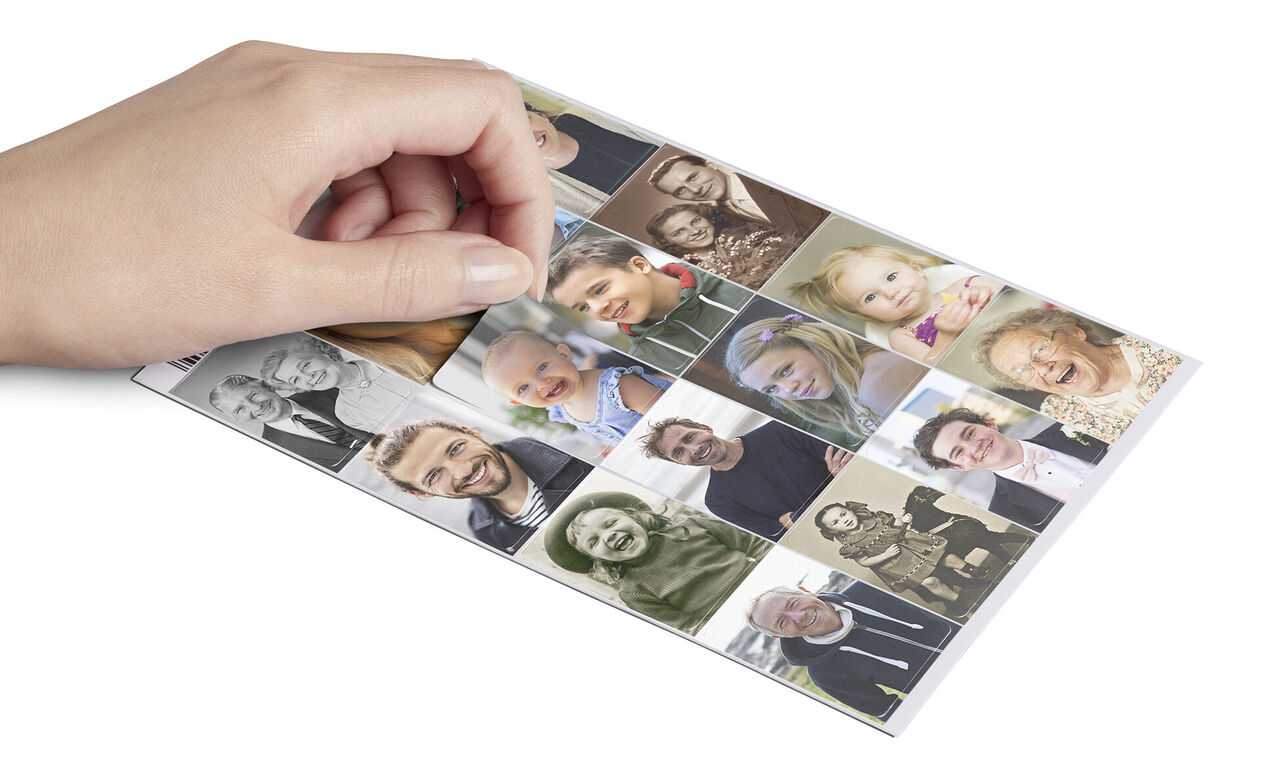 A hand holds a photo card with various pictures of joyful people.