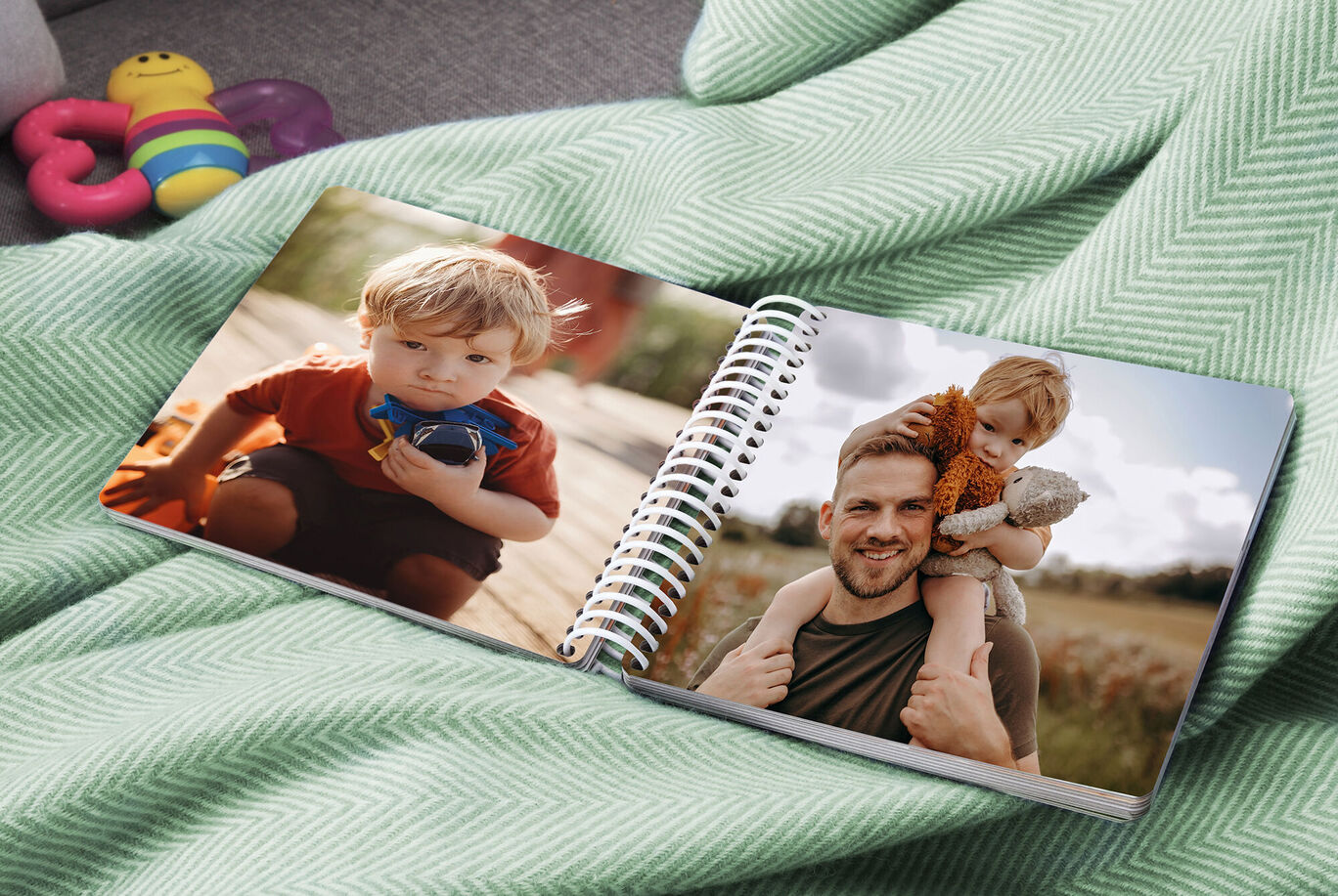 Two children on a photo book with joyful memories of happy moments.