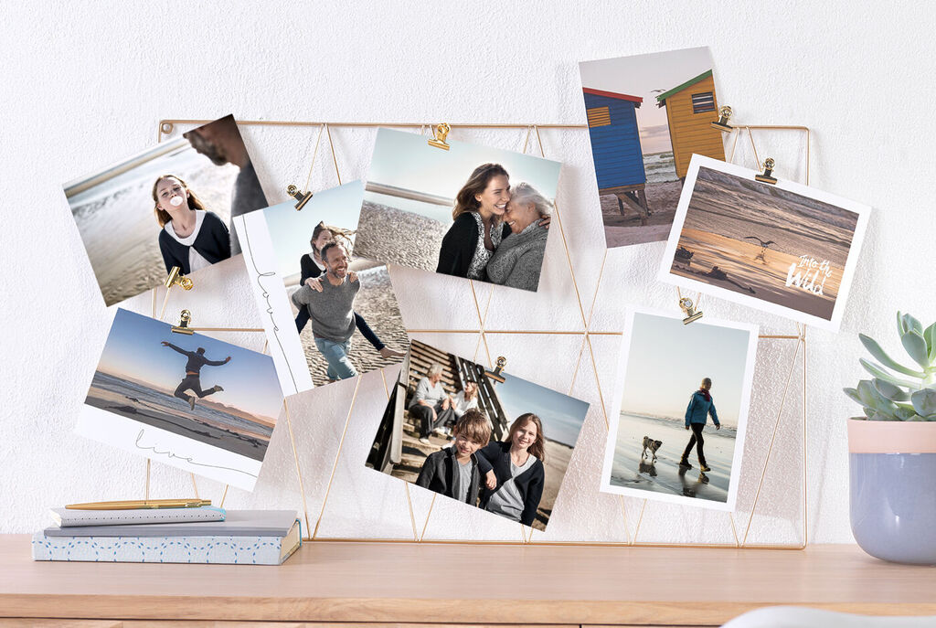 Picture frame with photos of happy moments at the beach.