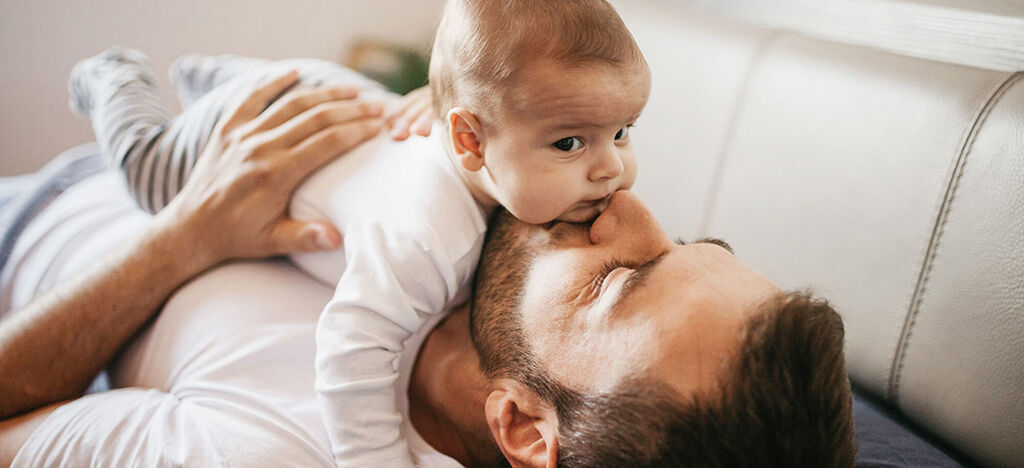 Father and child enjoying a cuddle, beautiful snapshot.