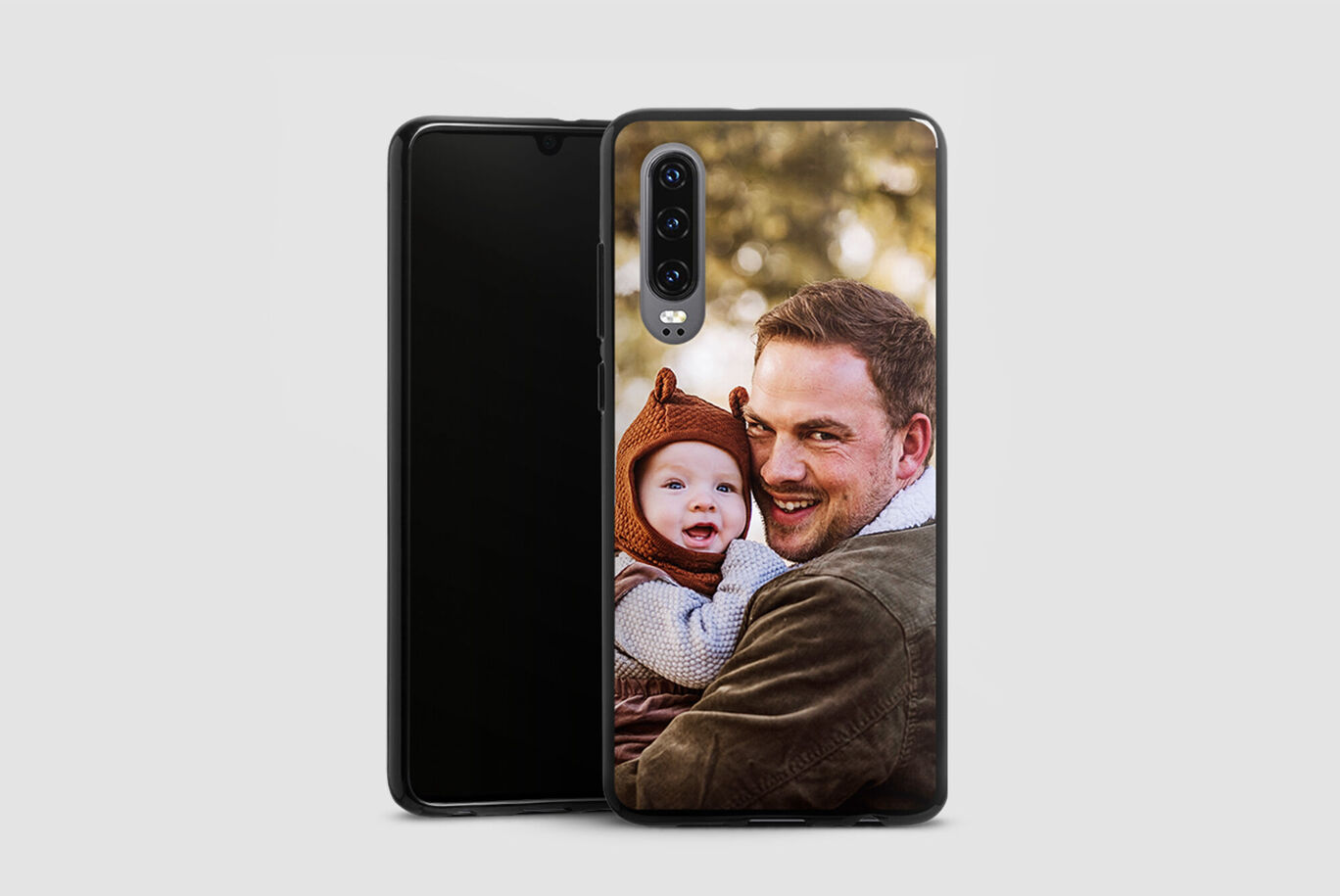 A smartphone shows a photo of a father and child interacting with each other.