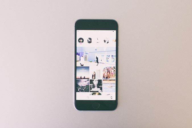 A smartphone shows various photos and memories on a screen.