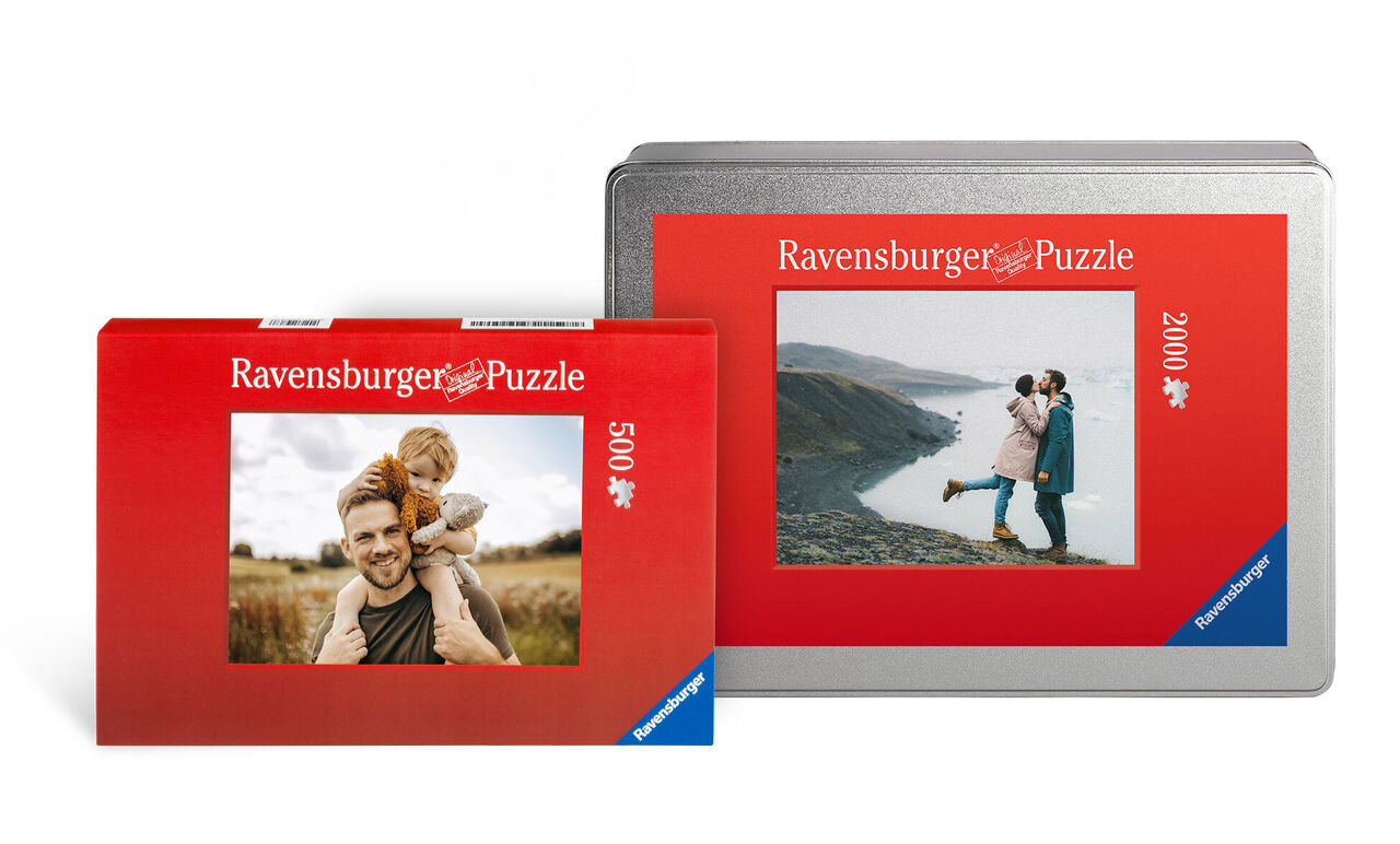 Two Ravensburger puzzle packages in red, one with a 500-piece design and one with a 2000-piece design in front of a landscape.