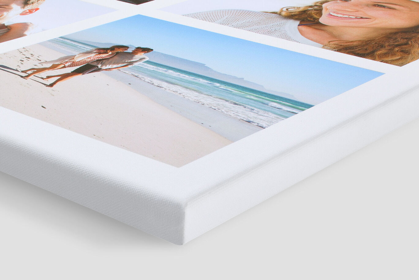 Close-up of a white wall picture with family photos at the beach.