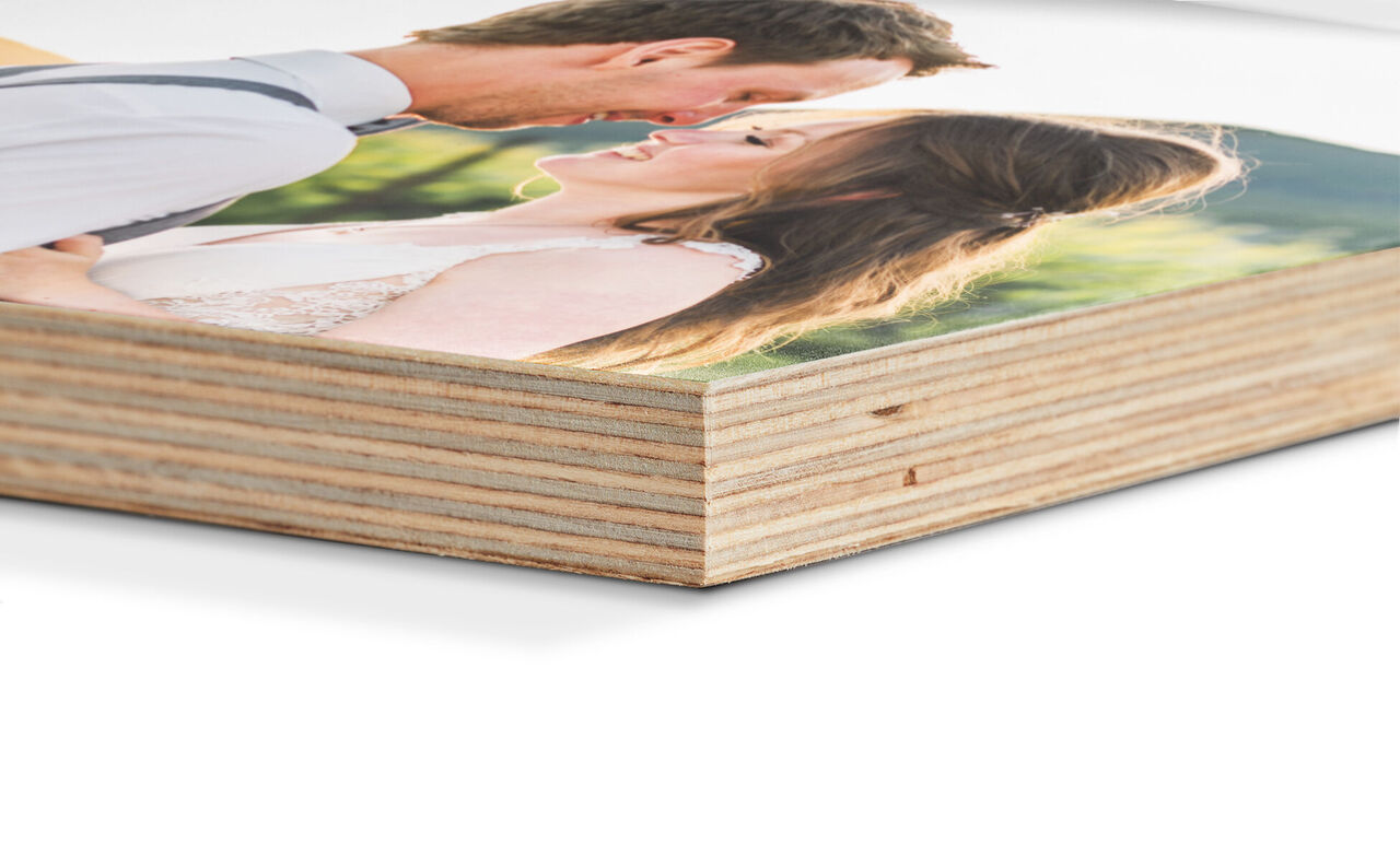 Close-up of a CEWE photo book with a romantic photo couple on the cover