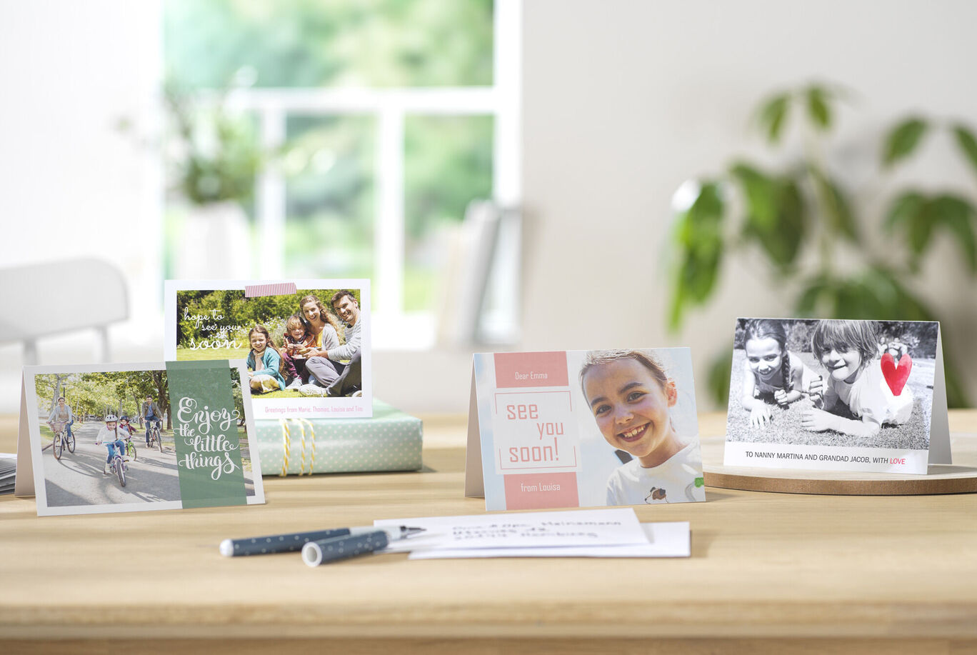 A charmingly arranged table with lovely greeting cards sharing special moments and memories. An invitation to celebrate and connect.