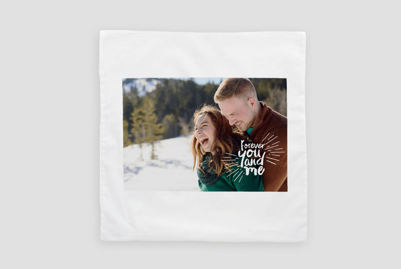 A snowy landscape with two people embracing. Above it reads 'forever', depicting a loving bond.