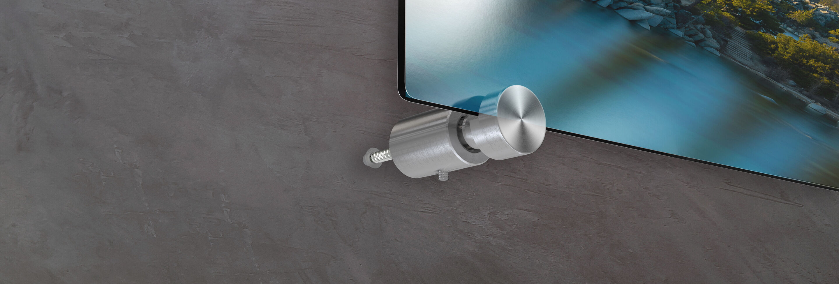 Close-up of a wall mount for a wall picture, fitting against a gray wall