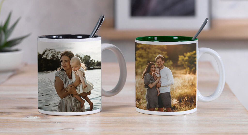 Two custom mugs with family photos on a table