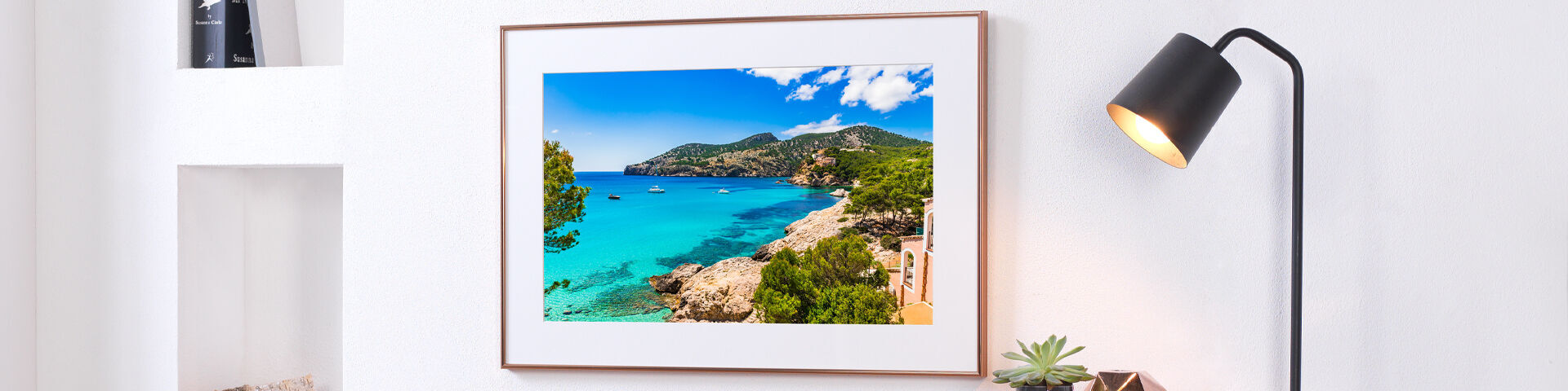 A beautiful wall art depicting a sunny beach with clear blue water and green trees.