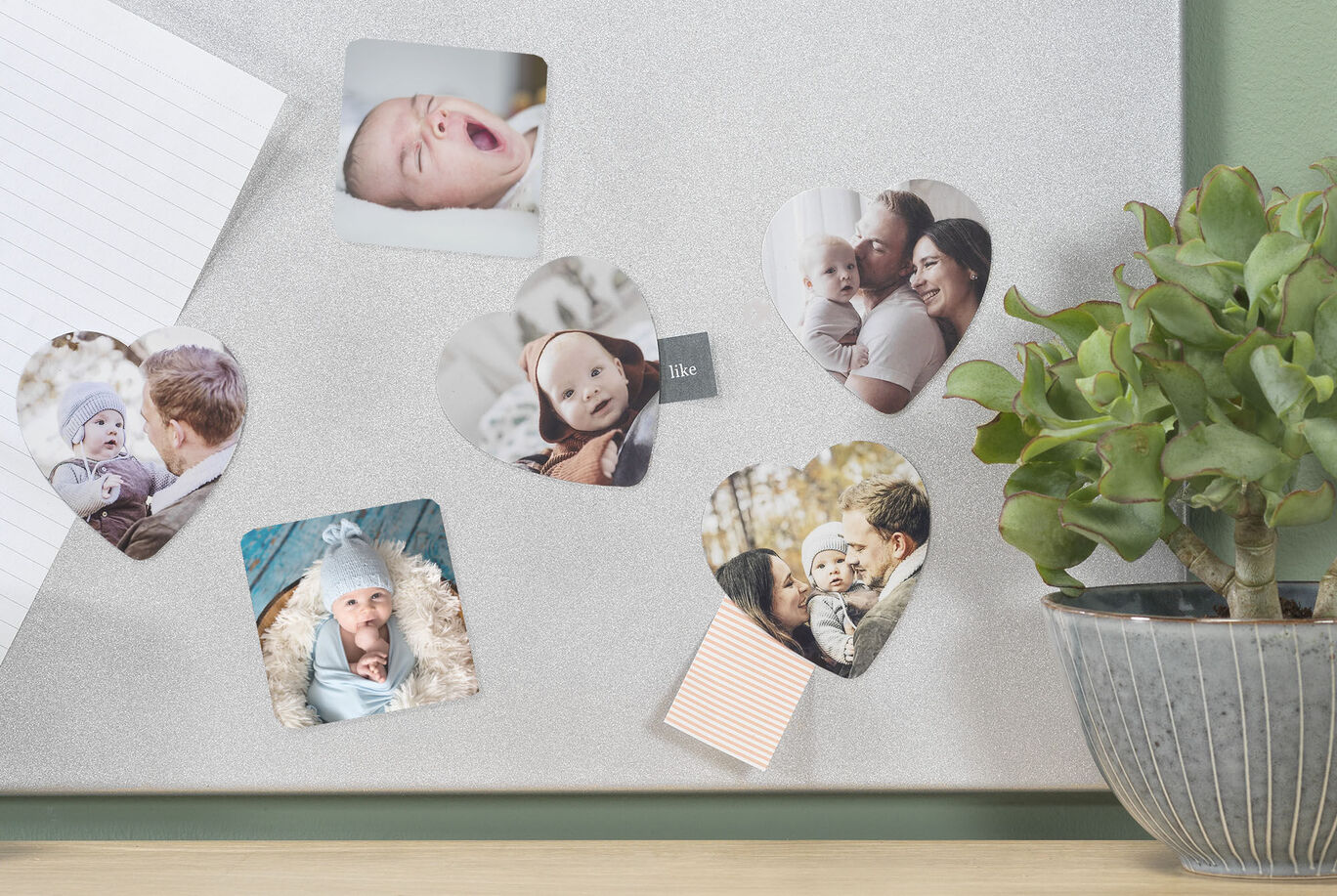 Heart-shaped photos on a bulletin board showing happy moments