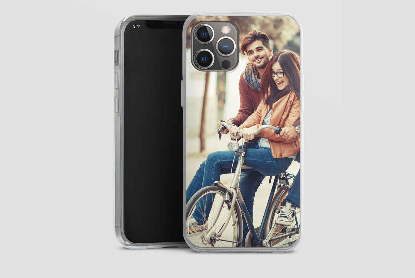 A smartphone cover with a couple on a bicycle laughing and having fun together.
