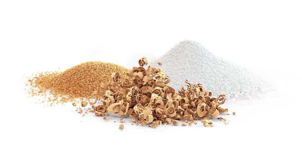 Three piles of sugar and sugar sprinkles in various colors.