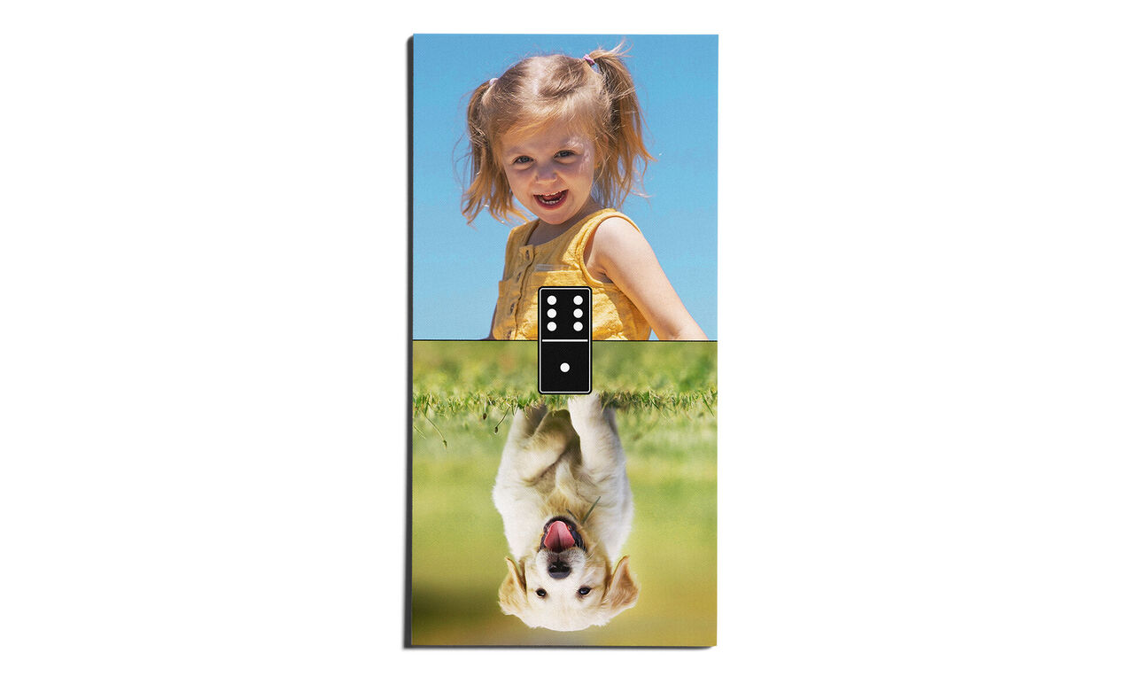 A joyful child in yellow clothing stands outside. Below is a happy dog on the grass.
