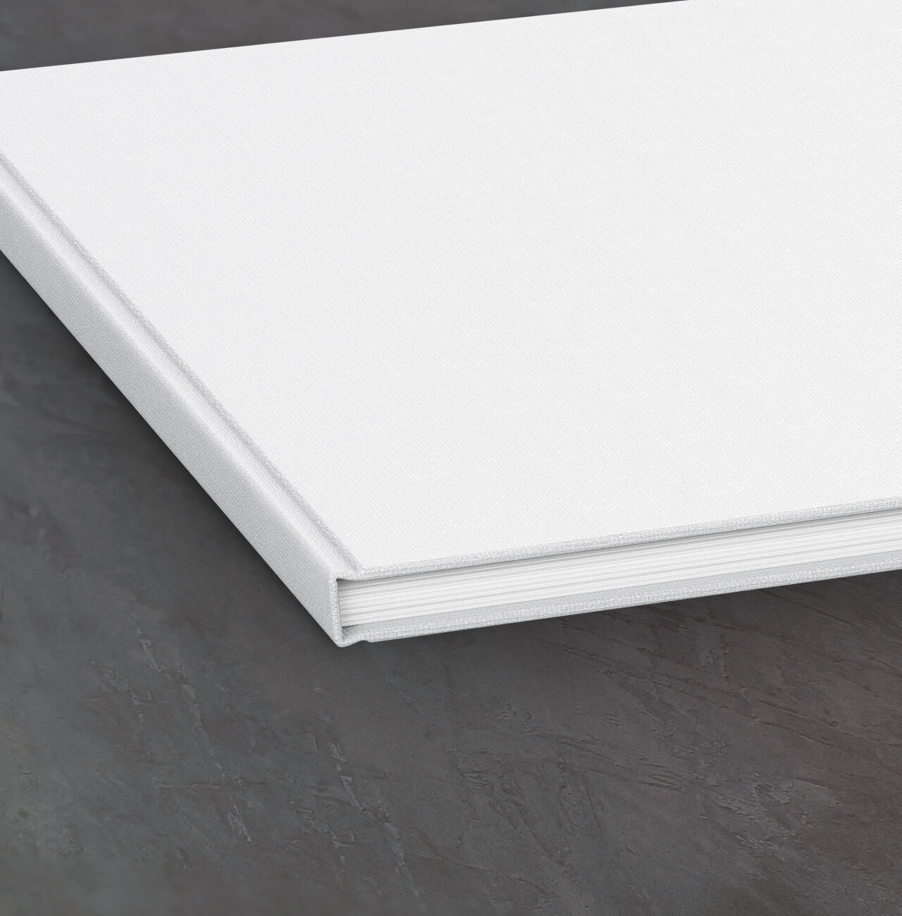 The cover of an empty CEWE PHOTOBOOK on a table.