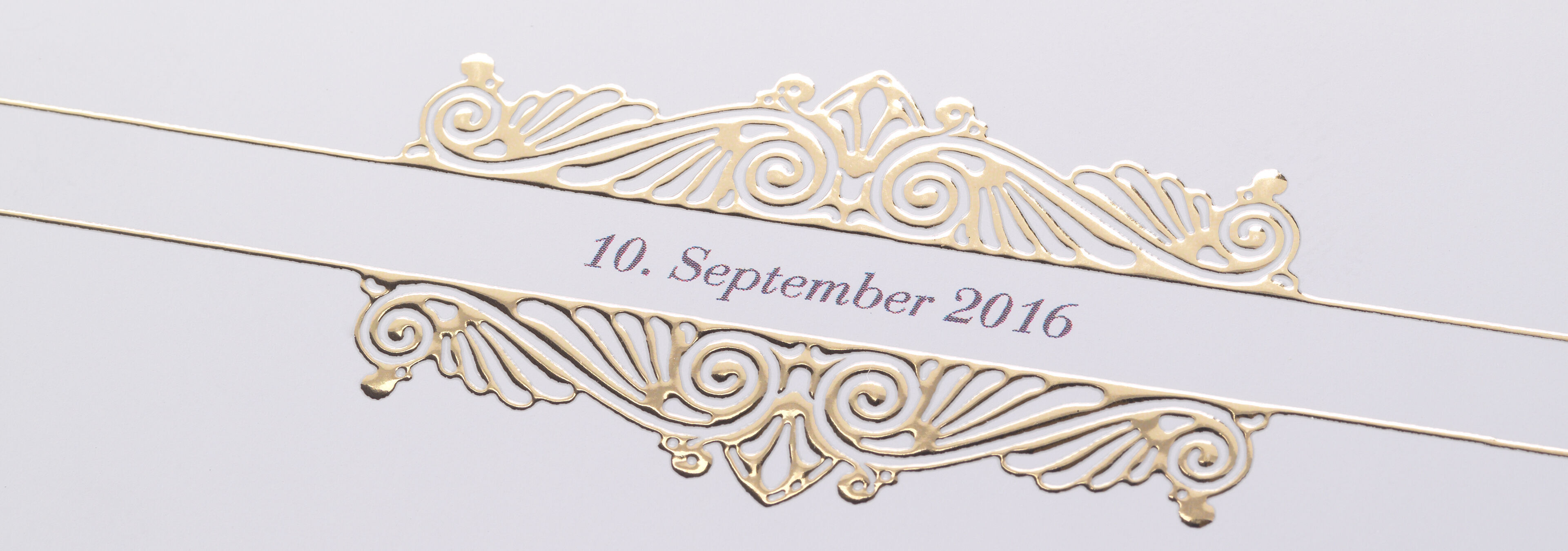 An elegant design with golden embellishments and a date