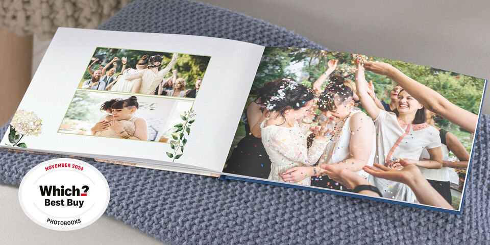 An open photo book showing happy people at a celebration. Colorful moments and emotions captured.