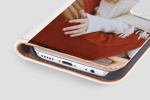 Close-up of a personalized phone case featuring two close friends hugging