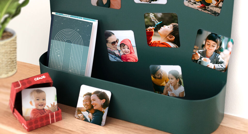 A creative arrangement of photos and a photo book in a modern container. Colorful memories and moments.