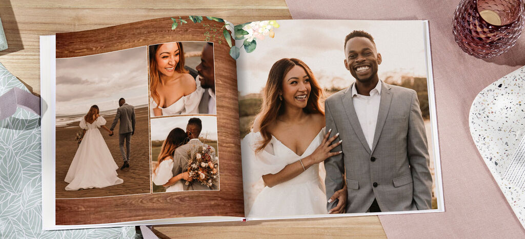 Two people dressed in white in a wedding photo book side view, surrounded by beautiful memories.