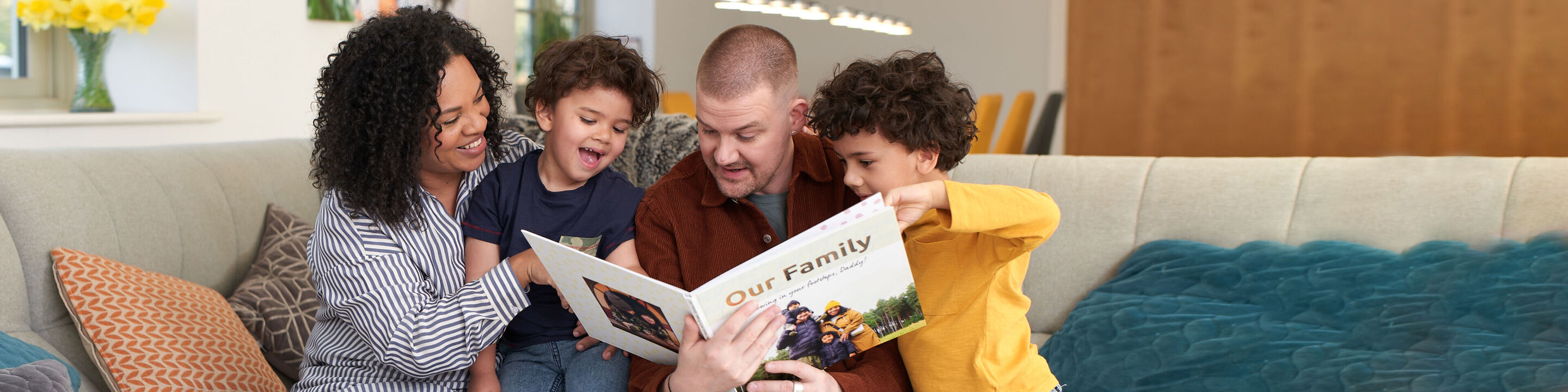 A family reading together in a photo book.