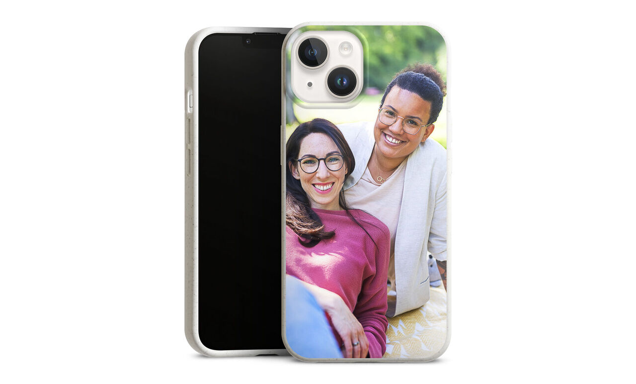 A loving snapshot of two people radiating joy and connection. Nature in the background.