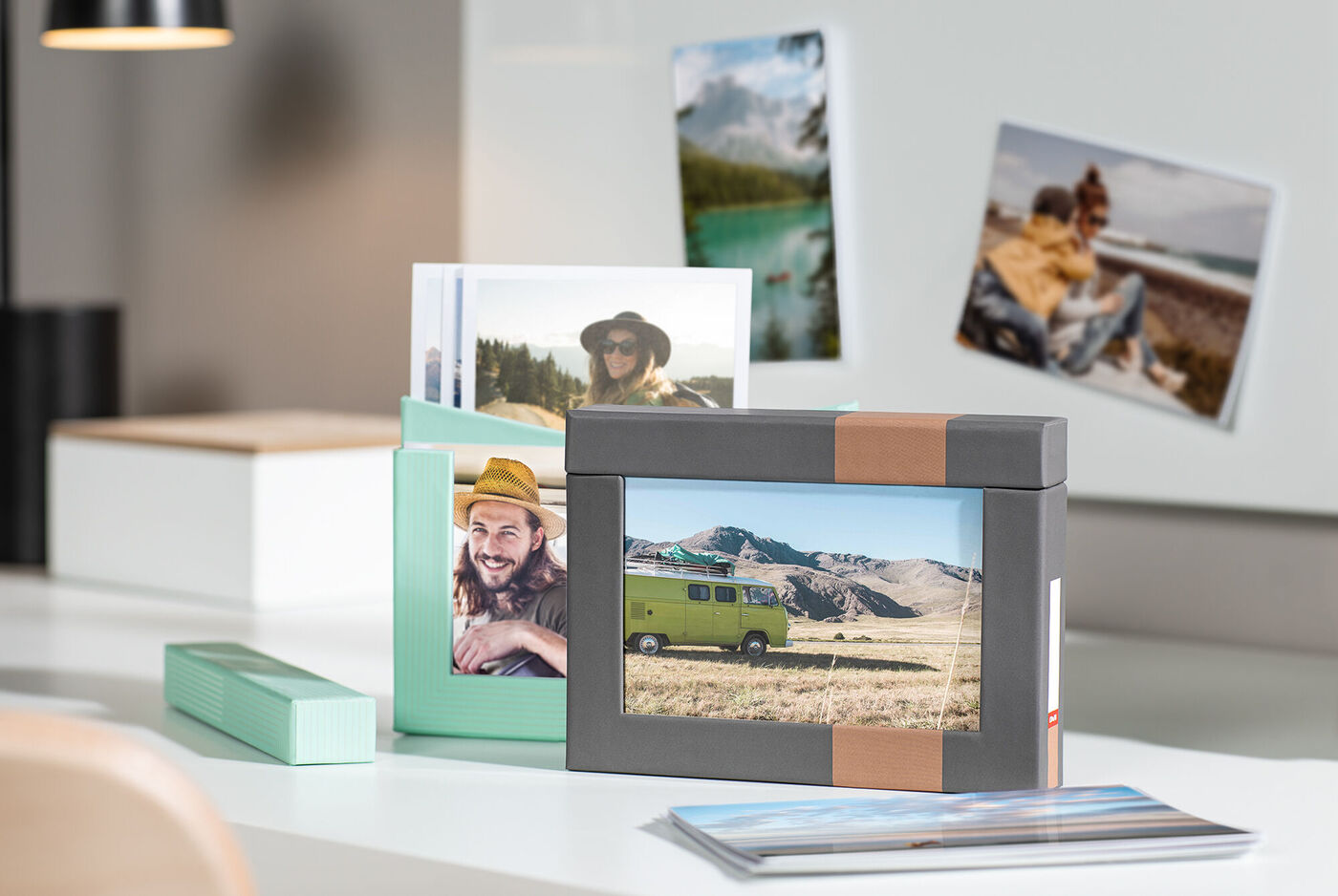 Two elegant photo boxes on a table with beautiful landscapes and travel photos.