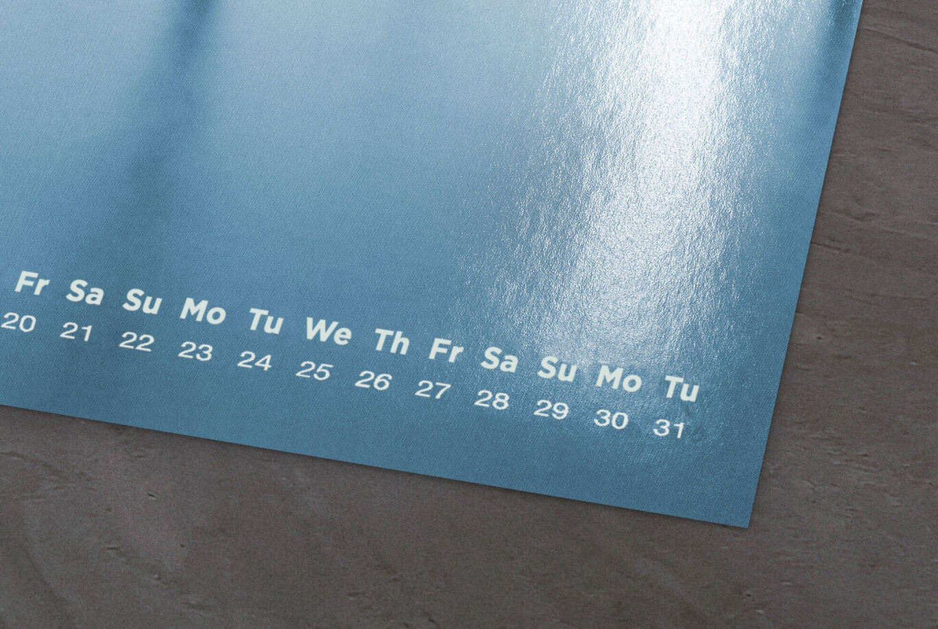 Blue wall calendar with weekdays and numbers, nicely designed and glossy.