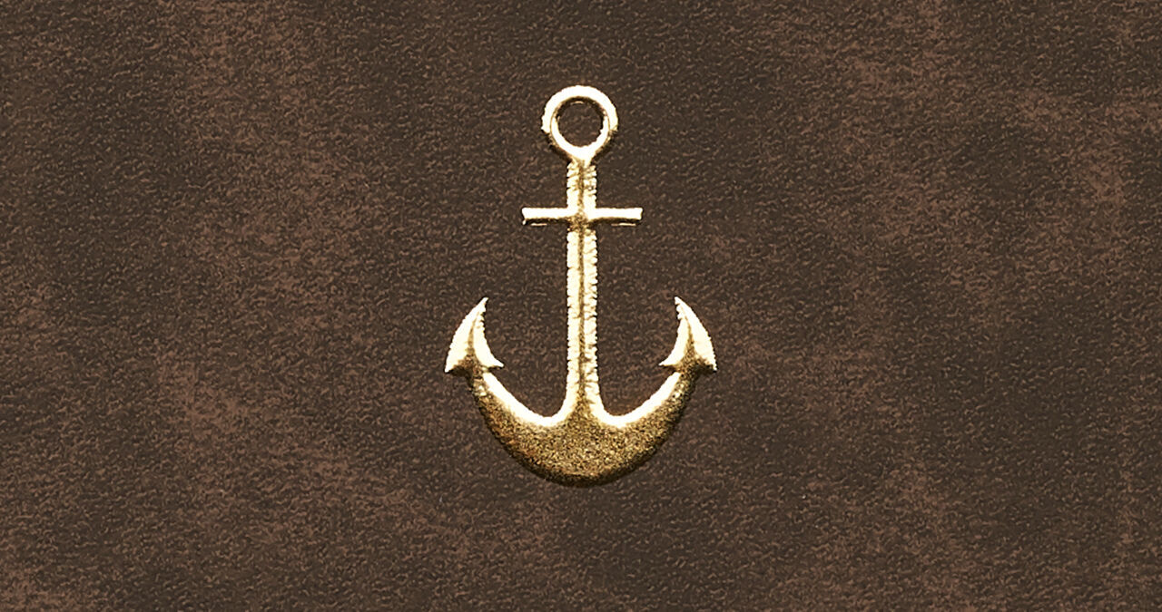 A golden anchor on a brown background.